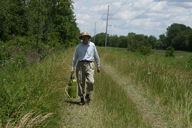 Kensel with sprayer at Romine Prairie